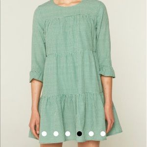 Green gingham print tiered mini dress by Compania Fantasic